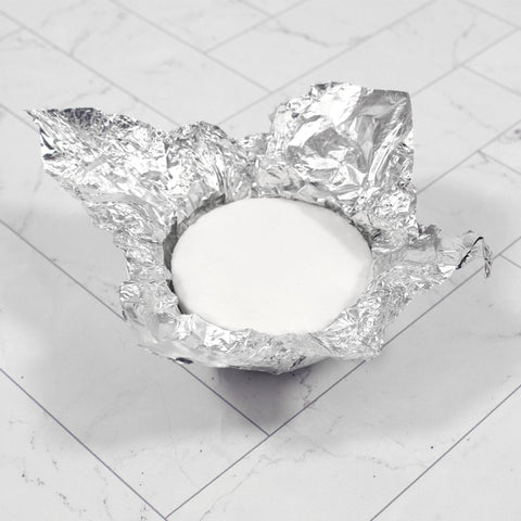 Image of Shower burst foil packaging open to show product. 