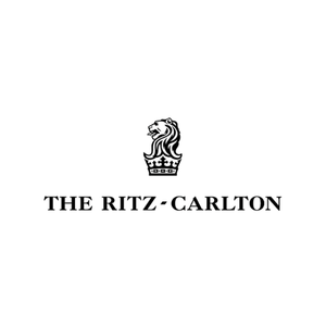 The Ritz Carlton logo featuring a black lion and crown emblem above the brand name in black serif text on a solid white background.
