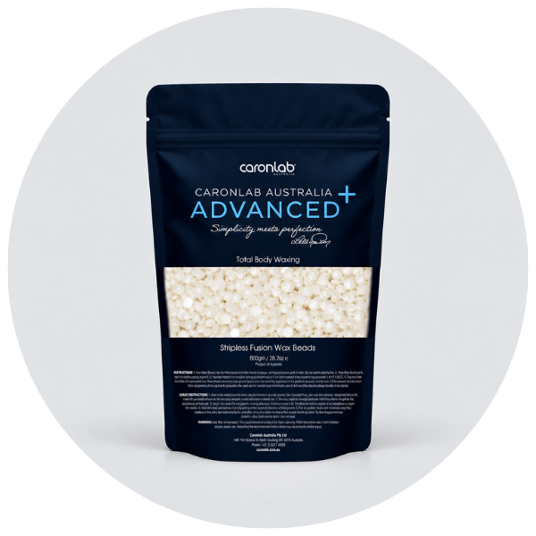 Navy pouch of Caronlab Advanced+ Stripless Fusion Wax Beads for total body waxing, with cream-colored beads visible through the window